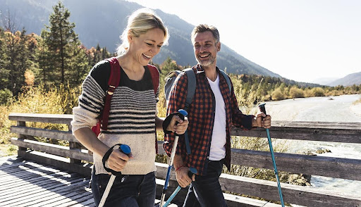 Couple hiking outdoors, embracing an active lifestyle after wellness transformation